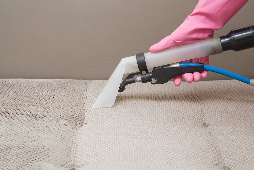 Tile cleaning with a pink glove in Fredrick