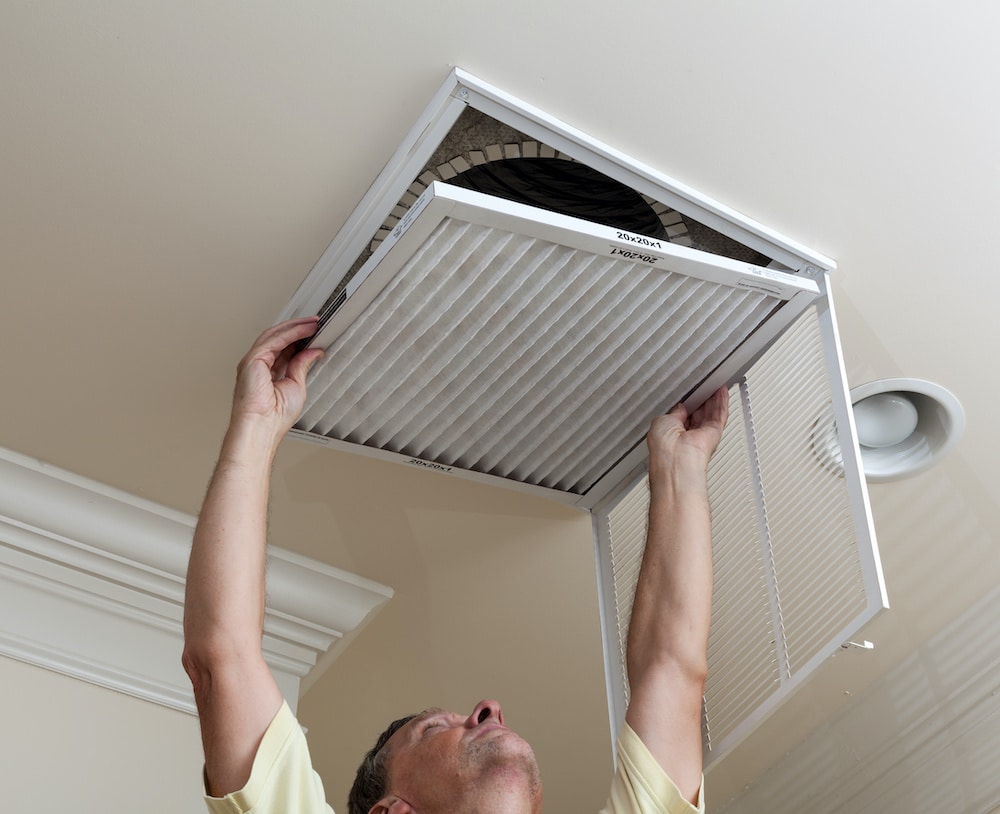 Man Working on Air Ducts for Air Duct Cleaning and Vent Cleaning in Herndon, VA