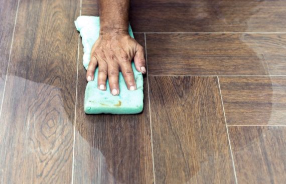 hand on the floor in the middle of a tile and grout cleaning in Reston