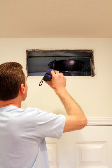 Man performing Air Duct Cleaning in Bethesda, MD