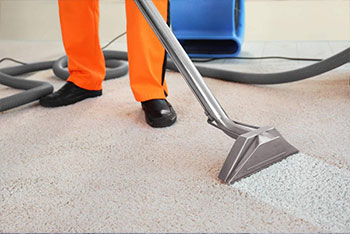 man in orange pants in the middle of carpet cleaning services in Leesburg