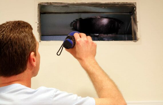 Air Duct Cleaning with a flashlight and Leesburg