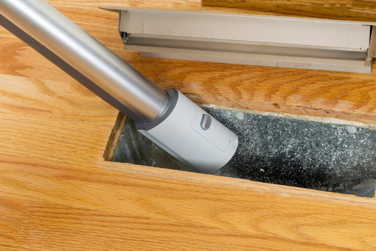 a vacuum being used to perform a floor Vent Cleaning in Rockville, MD, Reston, Bethesda, MD, Silver Spring, MD, Leesburg, VA, Frederick, MD